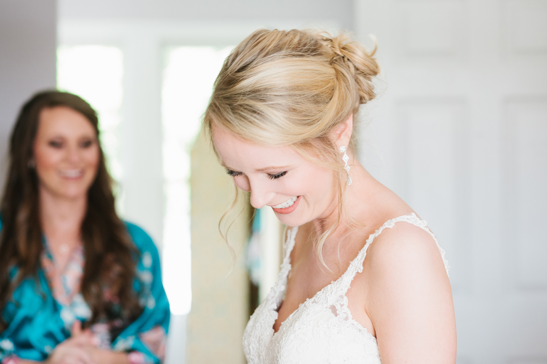 Bride Putting on Dress