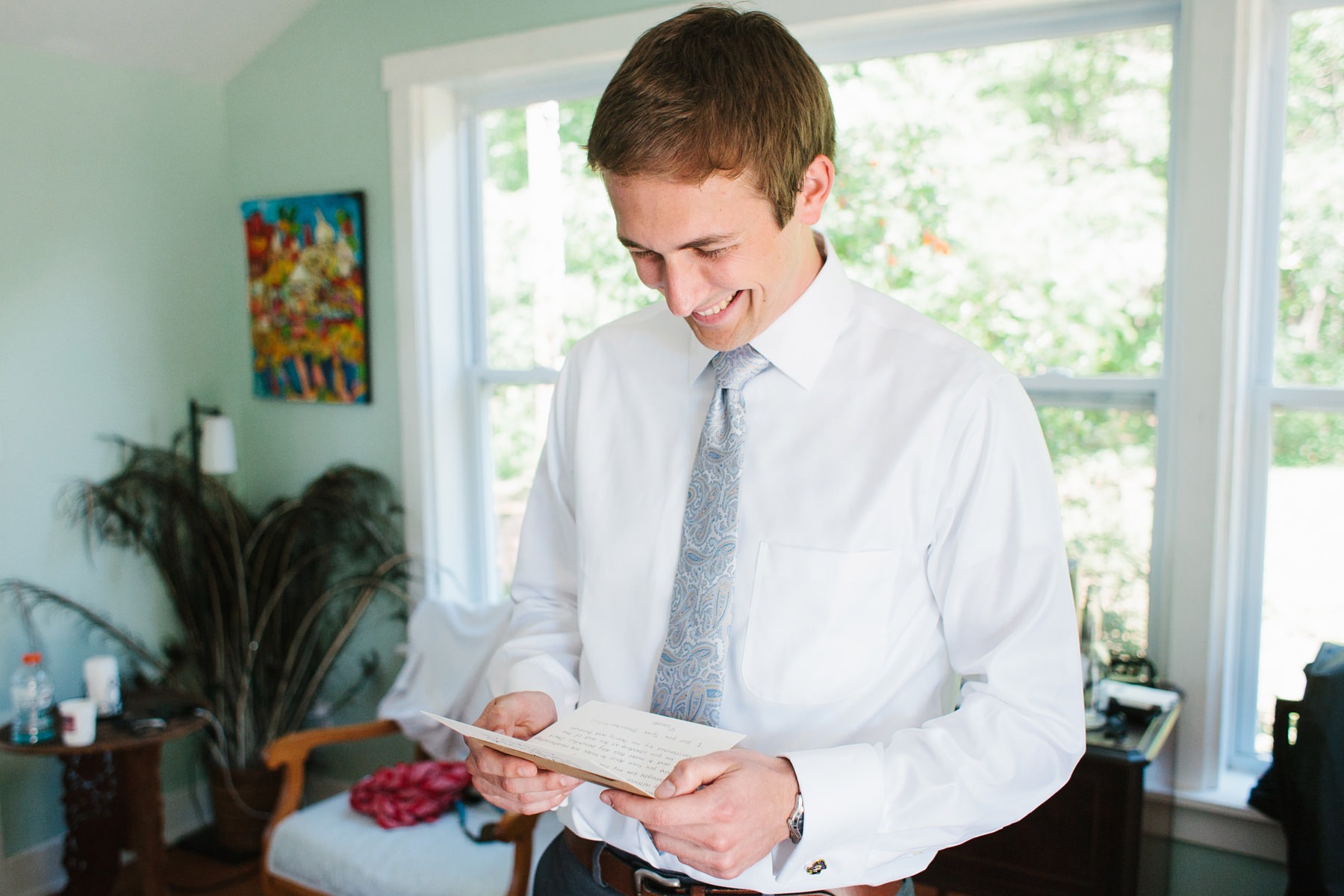 Groom Reading Letter From Bride