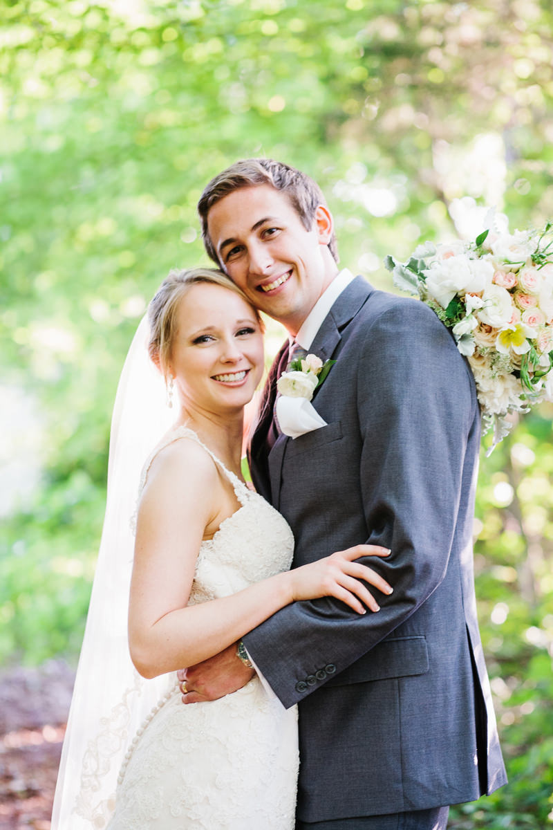 Bride and Groom Pose in the Woods