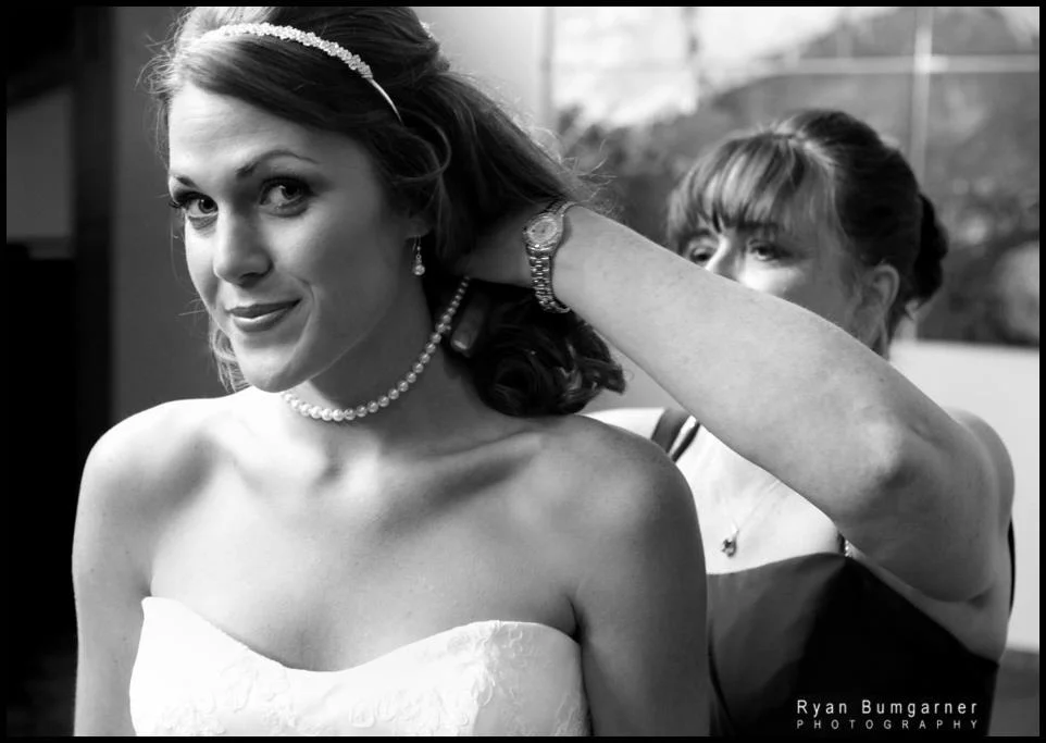 Asheville and Western North Carolina Wedding Photographer, Ryan Bumgarner, pictures of weddings at The Crest Center and Pavilion. Mother daughter dressing detail photograph in black and white. 