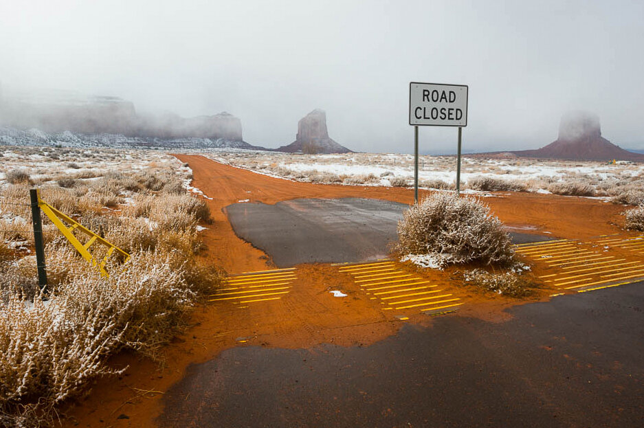 Tumbleweed &amp; cattle guard &amp; Road Closed sign, near entrance to Monument Valley Navajo Tribal Park, AZ