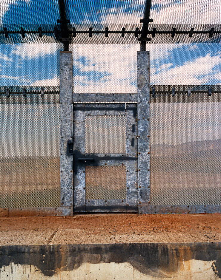 A U.S. Border Patrol entry door in the wall between the United States and Mexico in San Ysidro, California.
