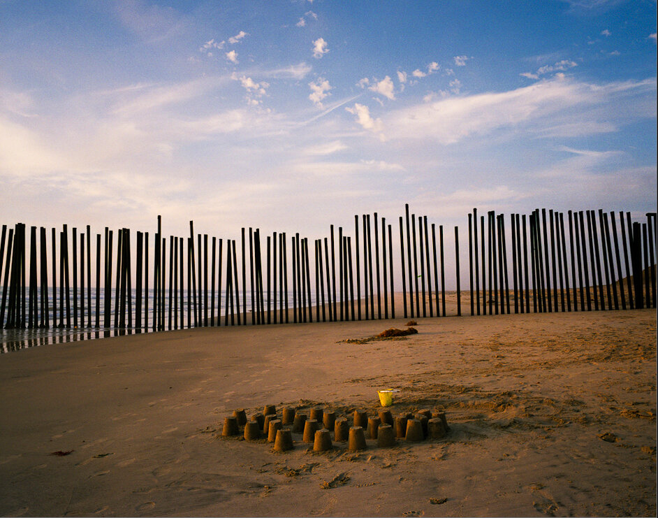 Upended railroad tracks serve as a border fence between Tijuana, Mexico and California, marking the western extent of the U.S.-Mexico border as it reaches the Pacific Ocean.