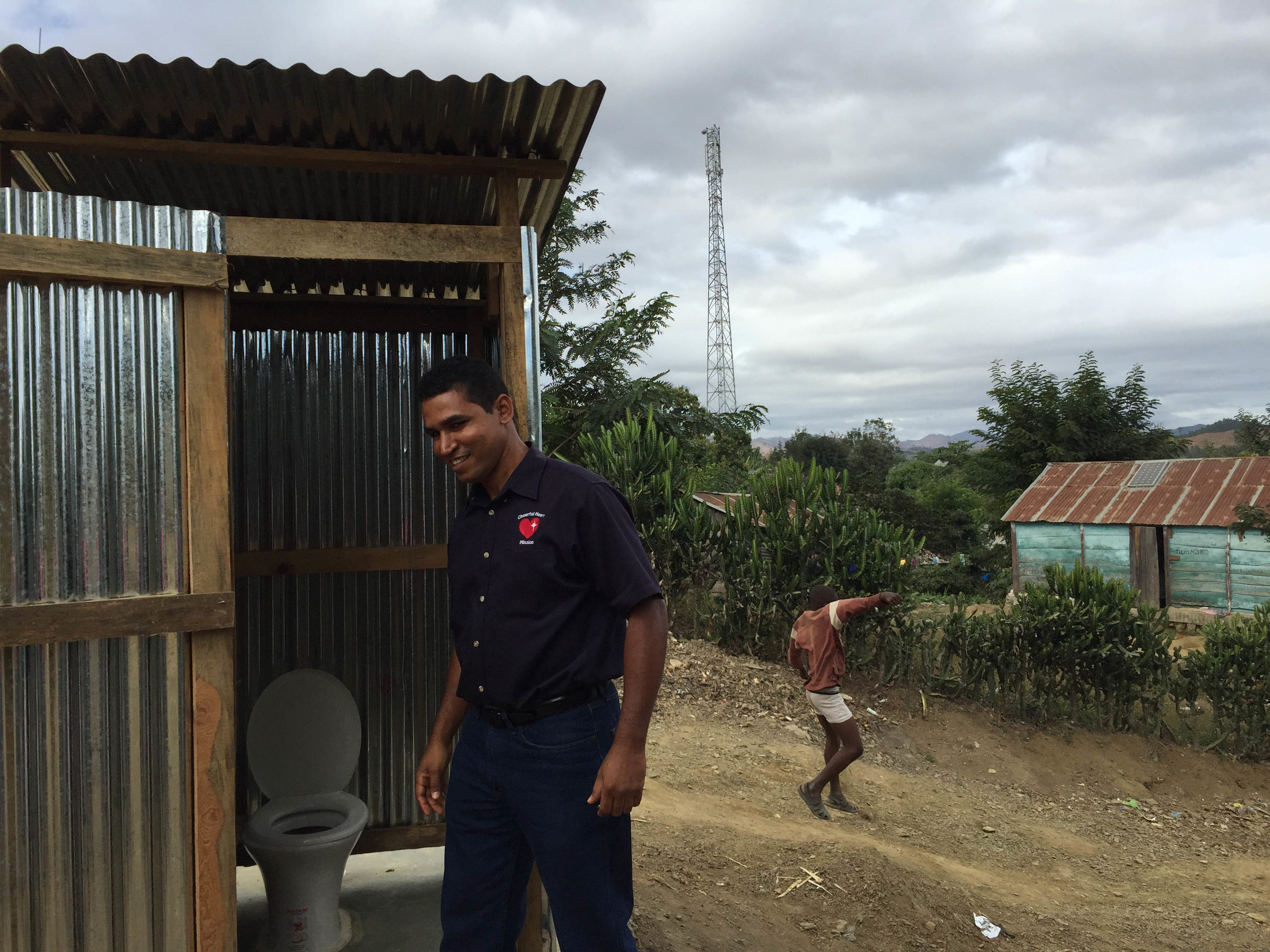 Luis Fragoso with a Newly Constructed Latrine in Tilori, Haiti