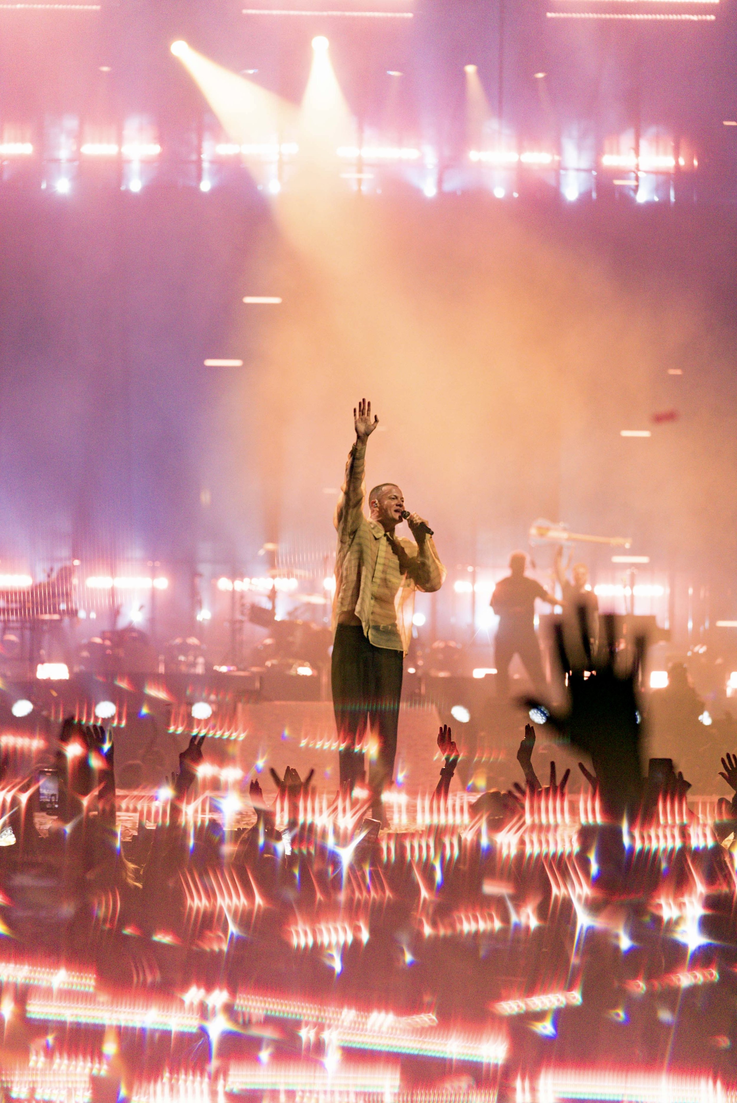 dan hand up wave vertical.jpg
