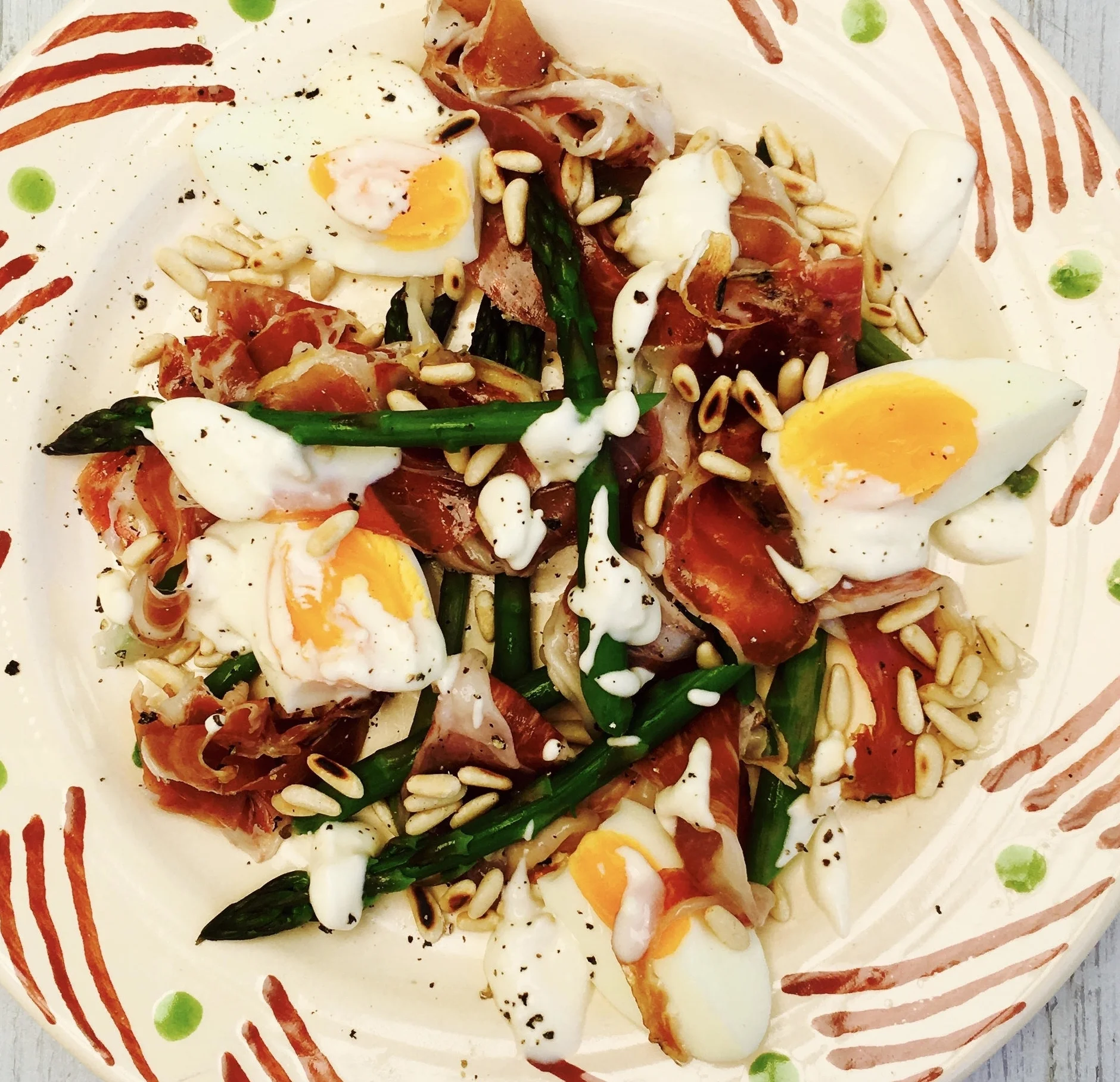 Prosciutto with eggs, asparagus and feta dressing