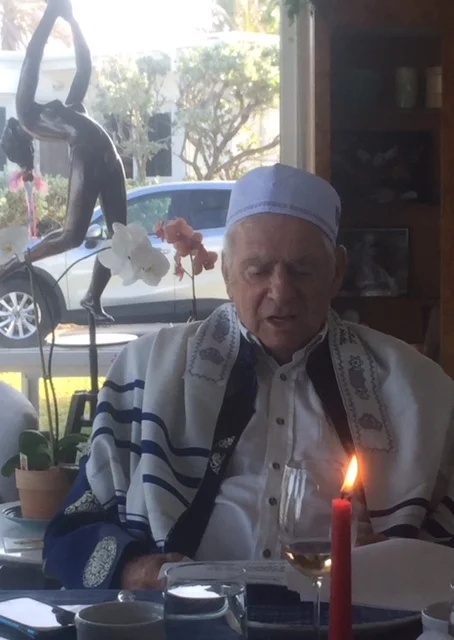 In addition to our family, we had three immigrant guest. I functioned as rabbi and I am shown below wearing a TAllis given by Sandra and a hat given by Mohammed. Rabbi Gerry with a Tallis brought by Brazilian woman who had cleaned for a Rabbi, the M…