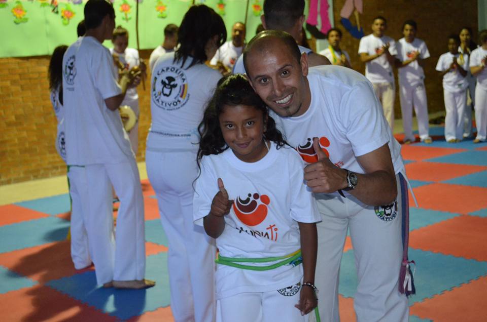 Profe Cristhian with little Jennifer whose Capoeira nickname is India