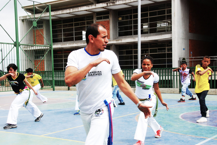 Cristhian with youth from Ciudad Bolívar practicing at the local school.