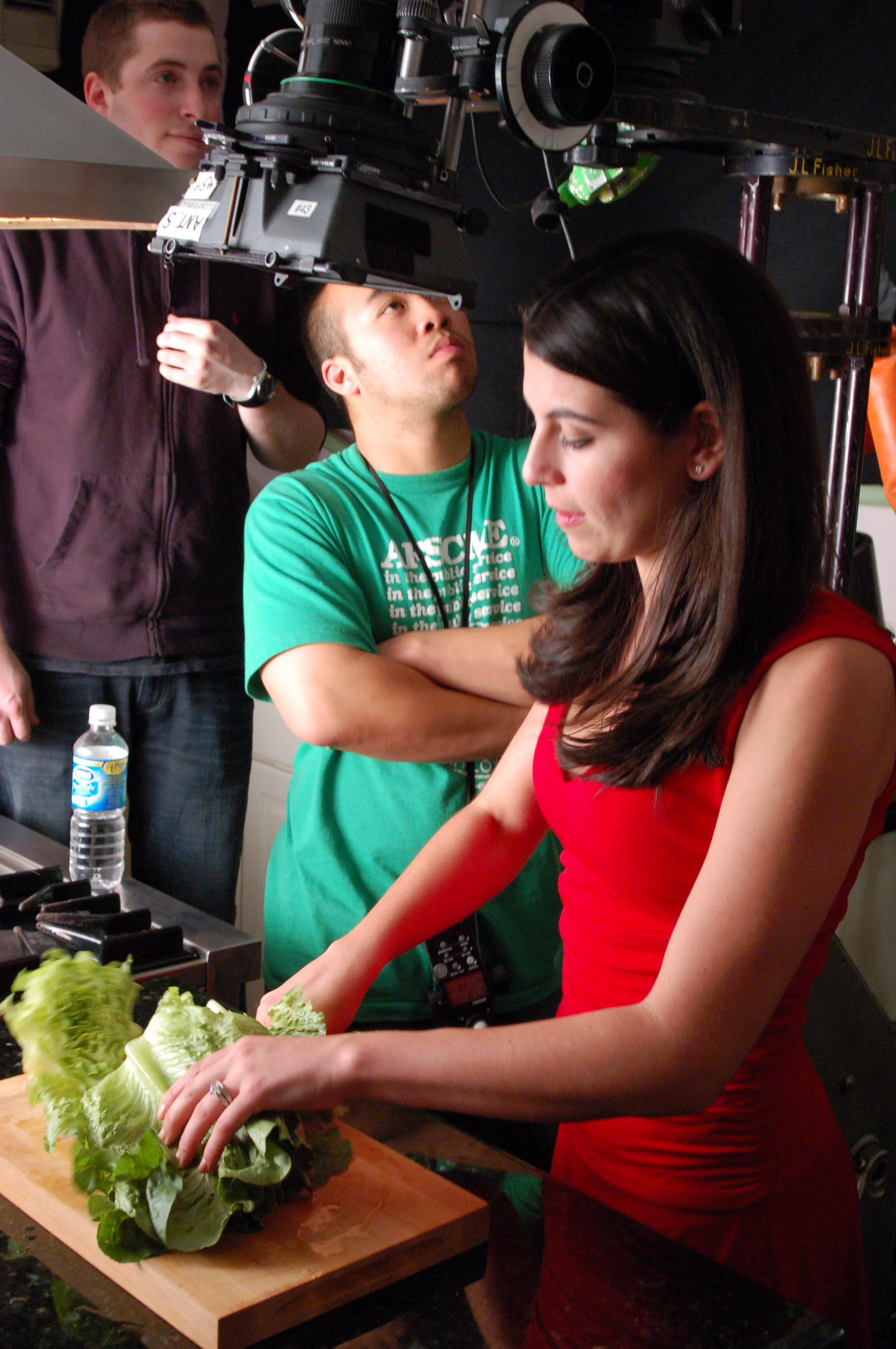 (From Left) Director Davey Sherwinter and cinematographer Paul Yee look on as Sarah Karjian gets her chop on.