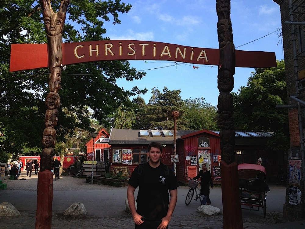 Me at the gate to Christiana, the autonomous commune within Copenhagen, Denmark. They had stands selling marijuana and hash right out in the open.