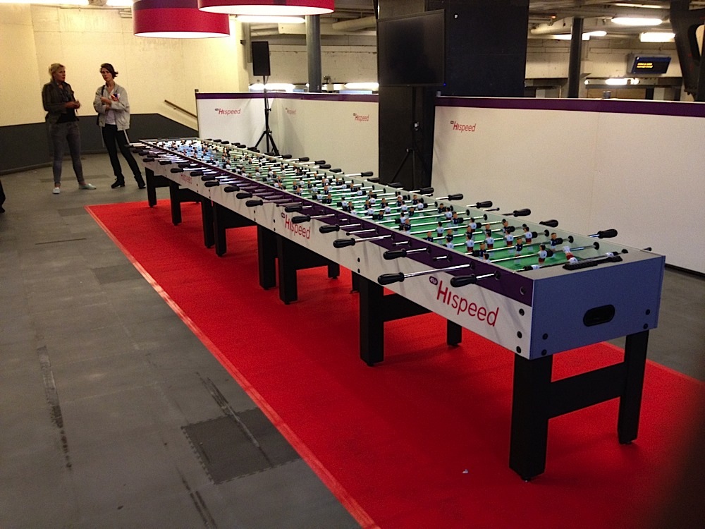 A very long foosball table set up in Amsterdam Centraal train station in Amsterdam, The Netherlands.