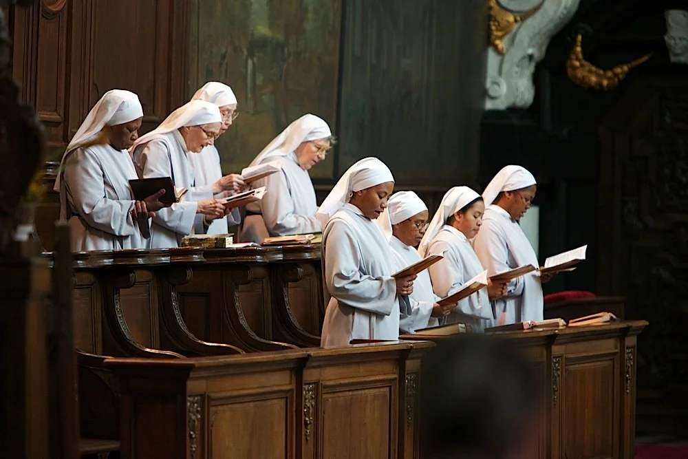 Nuns singing at the church at the beguinage in Bruges, Belgium.