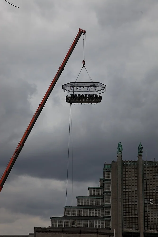 One of those sky-table things where you can have a meal suspended from a crane in Brussels, Belgium. I had never seen one in person. (See: http://www.dinnerinthesky.com/ .)