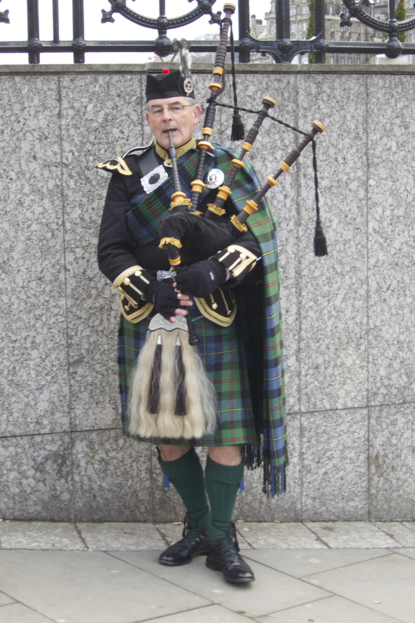 A bagpiper. (Edinburgh, Scotland.)