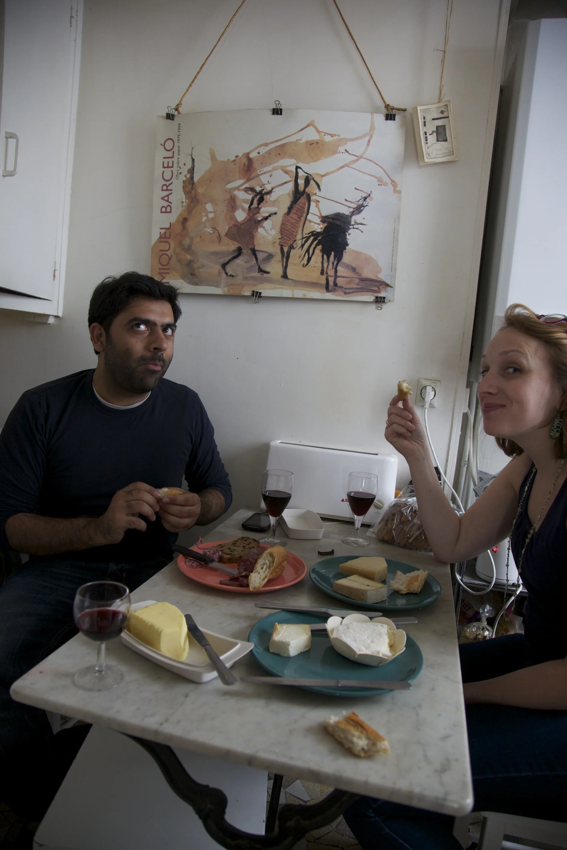 Enjoying bread, wine, cheese, and sausage with Rishi and Julie in the apartment.