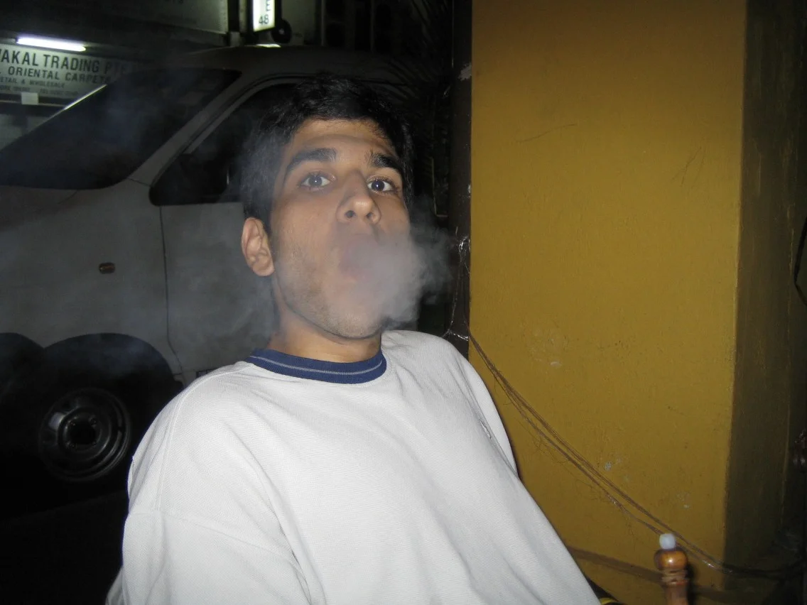 Aman blowing smoke