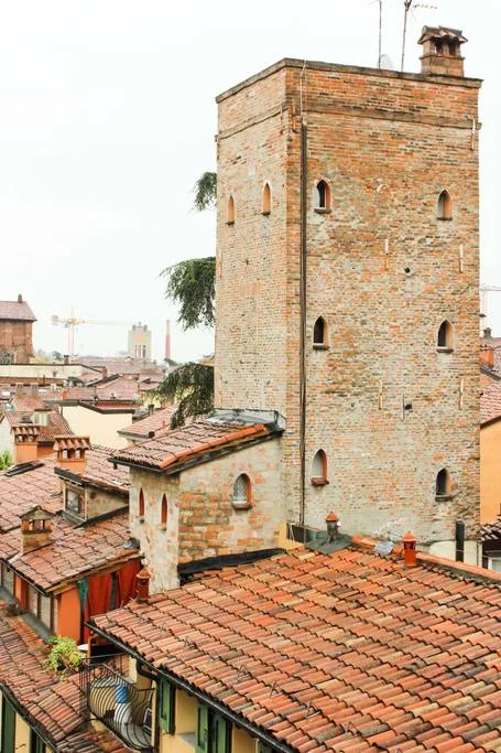 The apartment spanned four floors and a roof . P hoto courtesy of the AirBnB listing . (Bologna, Emilia-Romagna, Italy.)