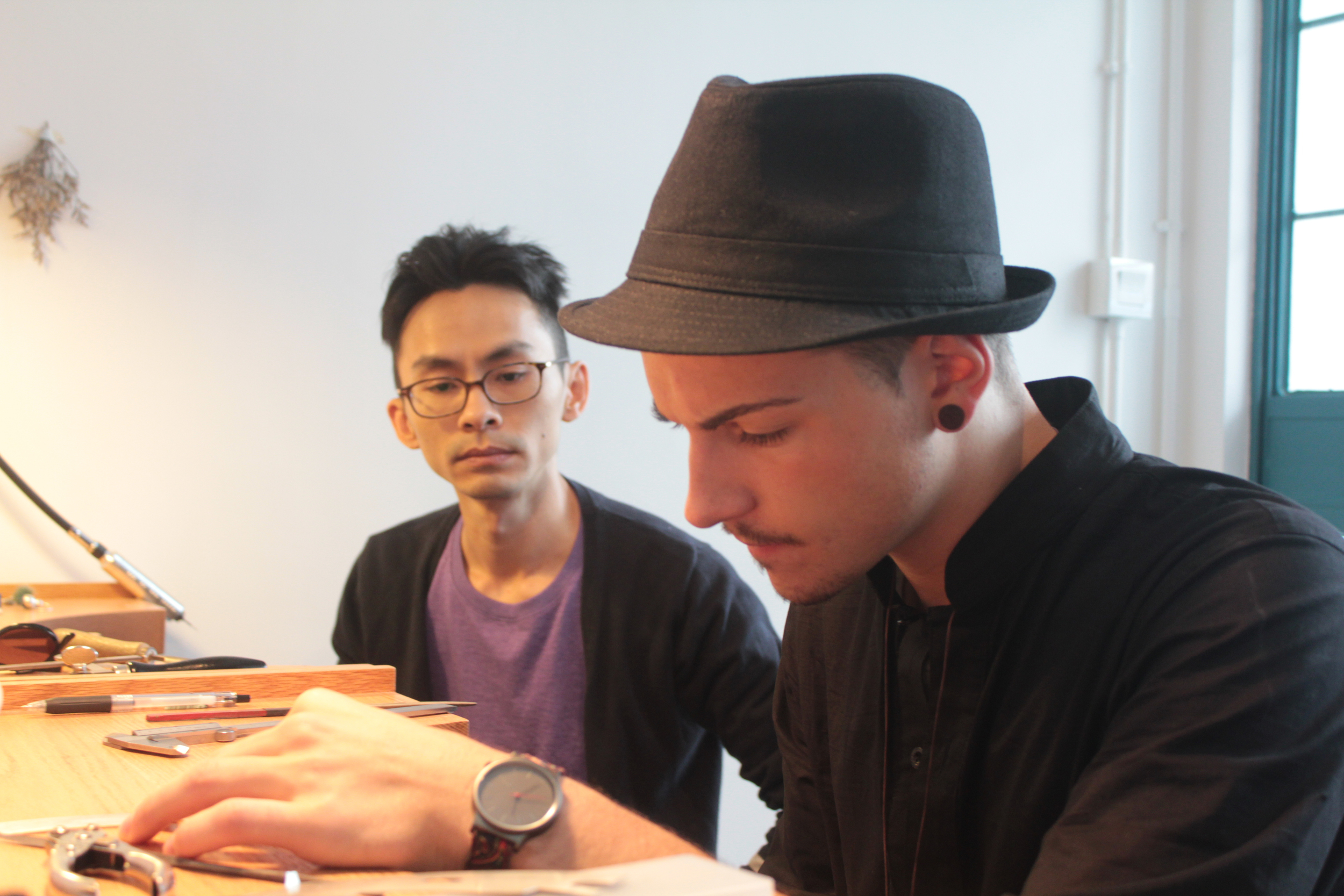 Nicola was focusing on making his tunnel earring.