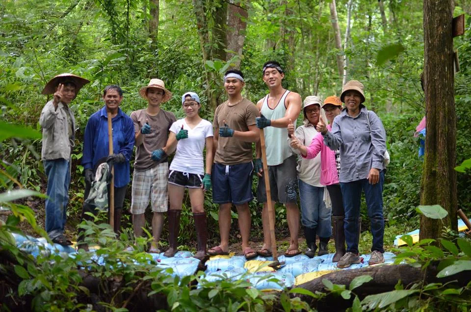 The winning team, Thai-Namic Trio, with community members