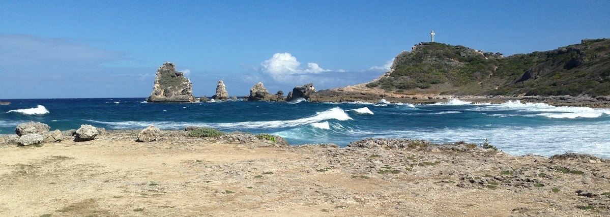 Pointe des Chateaux gets its name from the castle-like rock formations that dot its coast. Image courtesy of the Guadeloupe Islands Tourist Board.