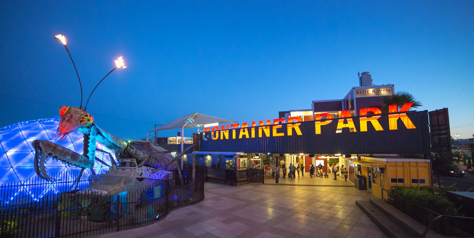 Las Vegas' Downtown Container Park features a Burning Man-inspired praying mantis that shoots fire while jamming out to classic rock tunes. Image courtesy of Downtown Container Park.