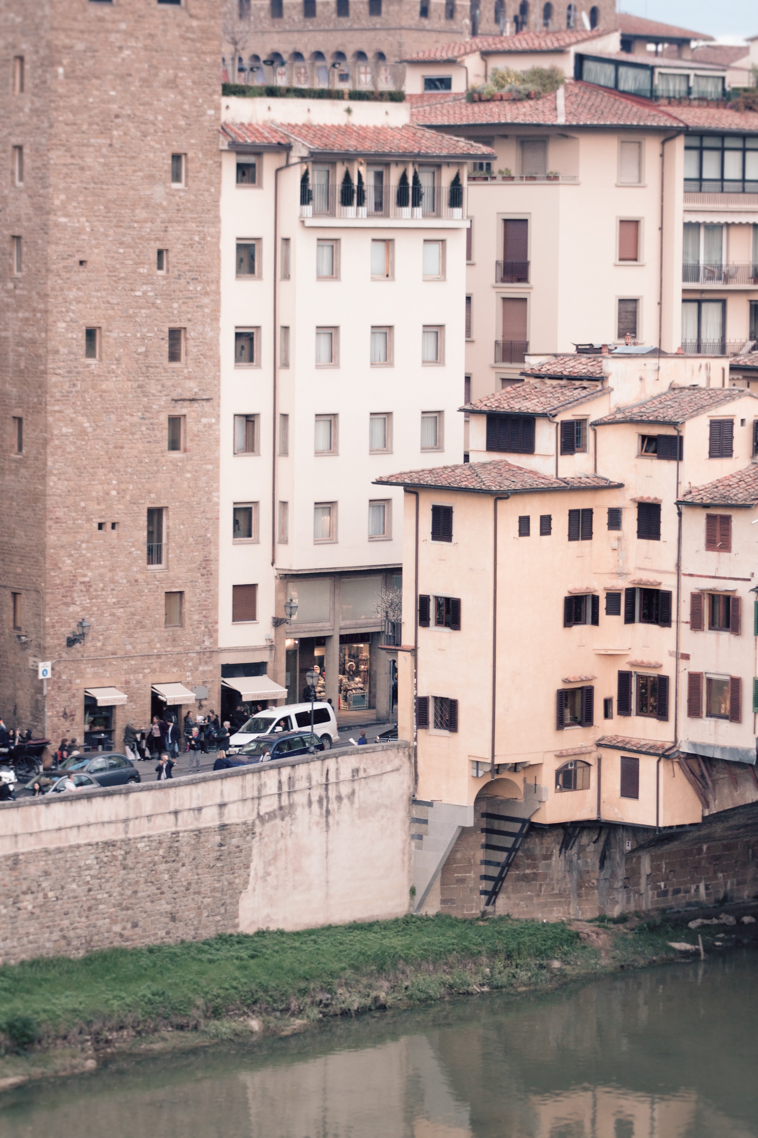 The Continentale is the white building in the middle and the yellow buildings across the street are the windows of the Ponte Vecchio shops