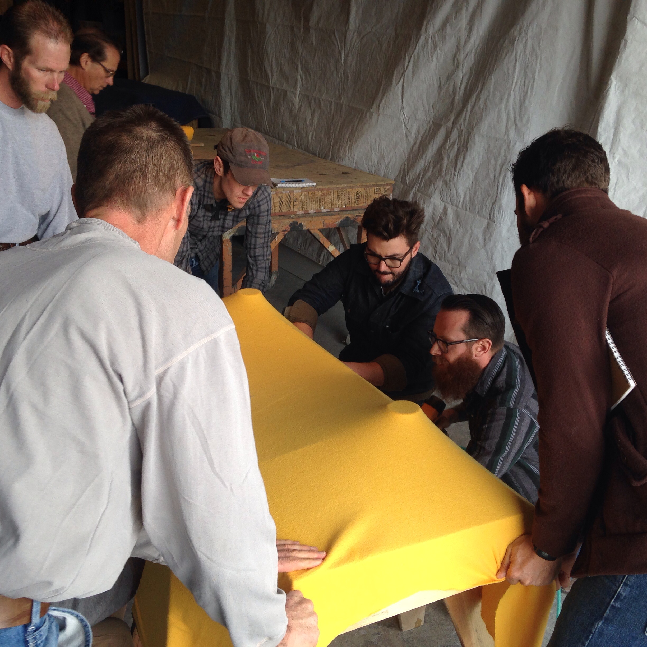  Attendees of a fabric-forming class in the process of creating an aesthetically beautiful and functional concrete sink 