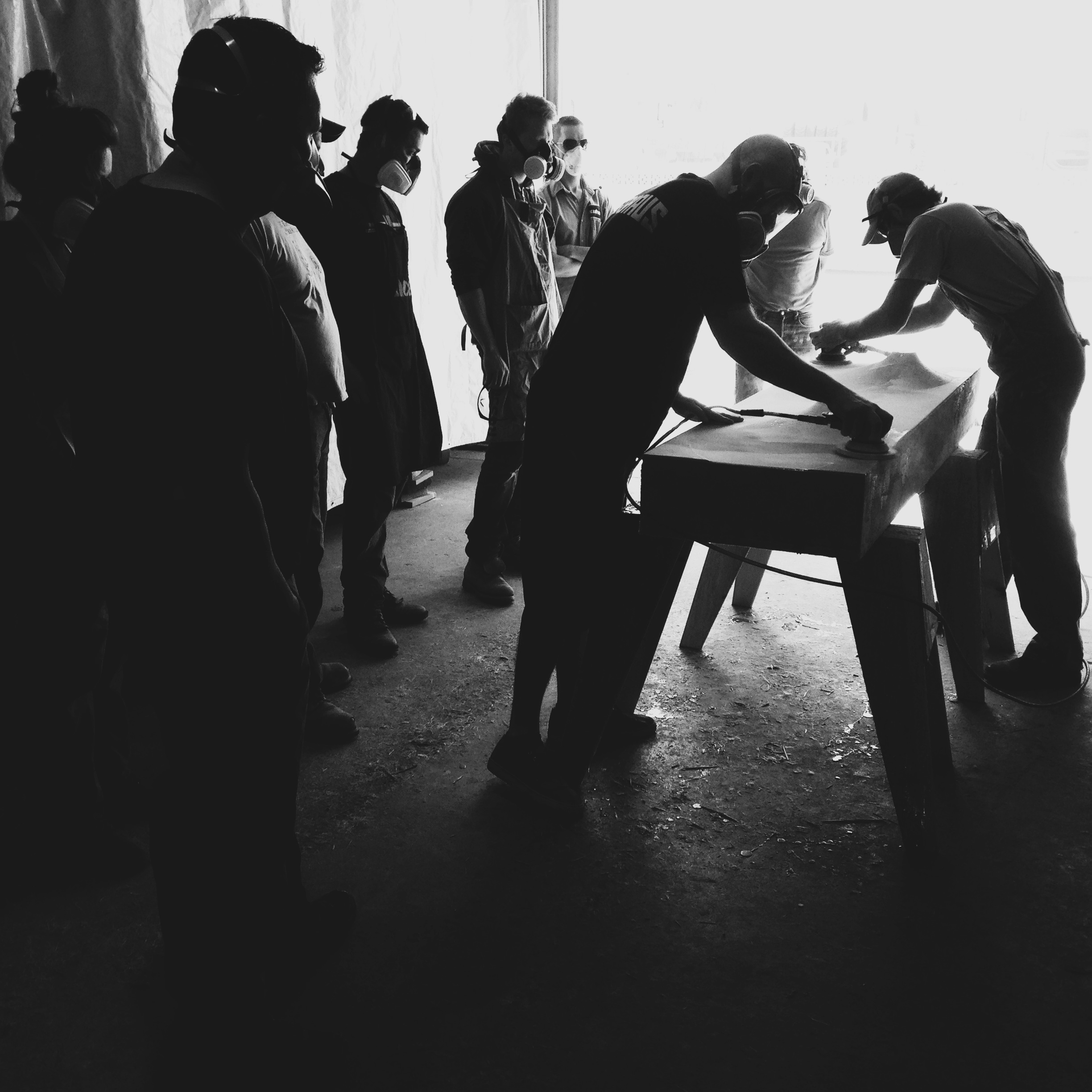  Students of a fabric-forming sink workshop learning how to properly finish a form 