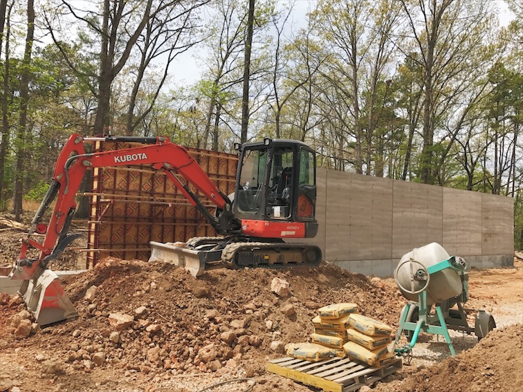  Mixing and pouring concrete window sills.&nbsp; 