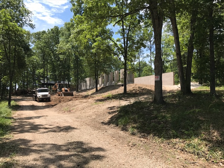  Buck excavating the hillside for parking. We probably hauled off 20-30 dump-truck loads of dirt!&nbsp; 