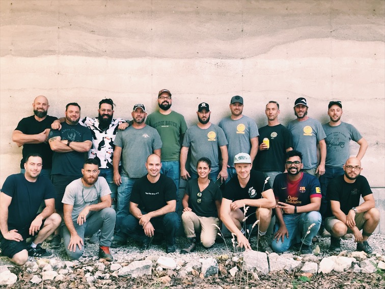 Attendees of the September 2018 DustyCrete Workshop - check out that rammed earth behind them!