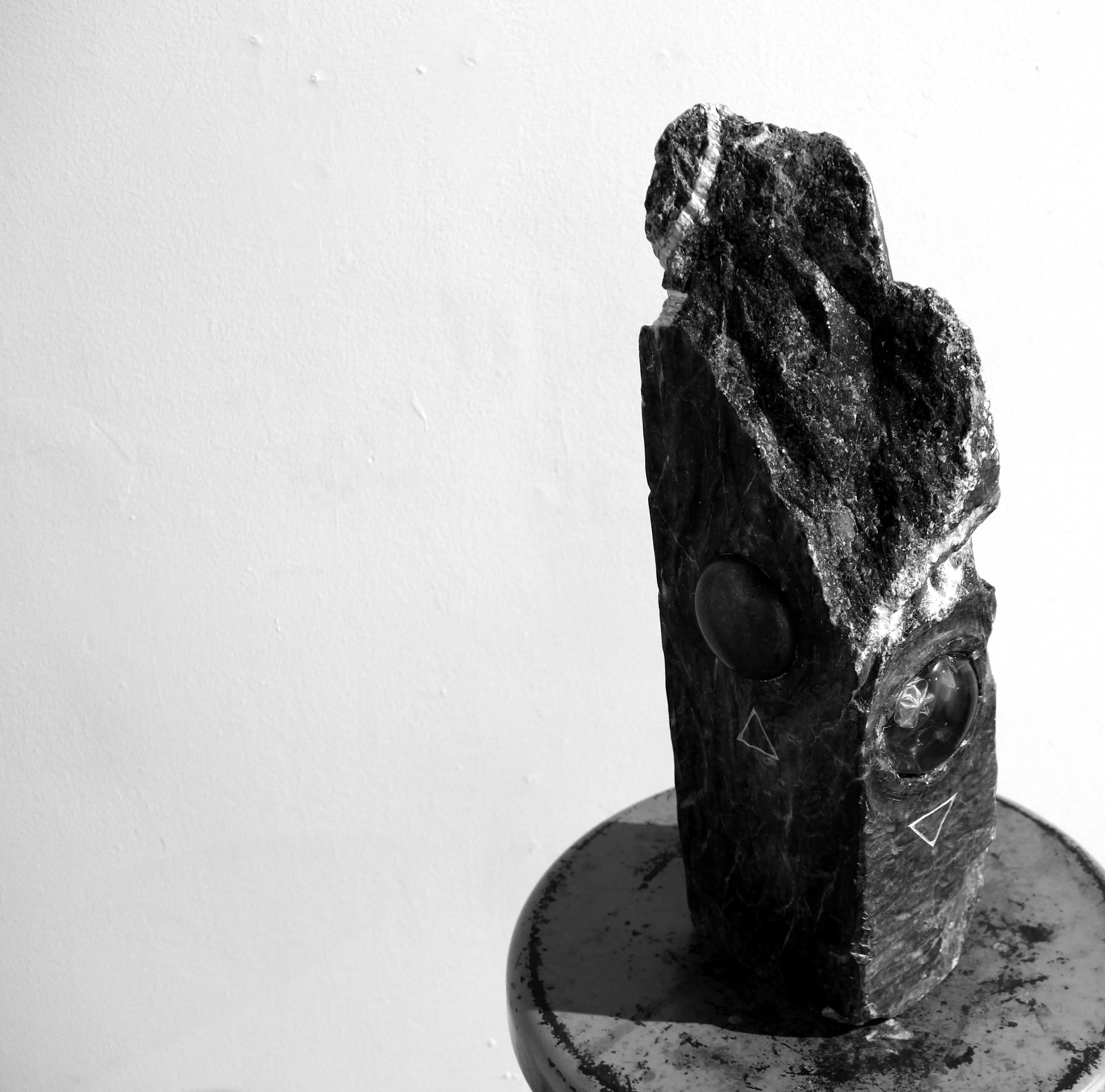  each side represents a classical element through iconography and carved details 