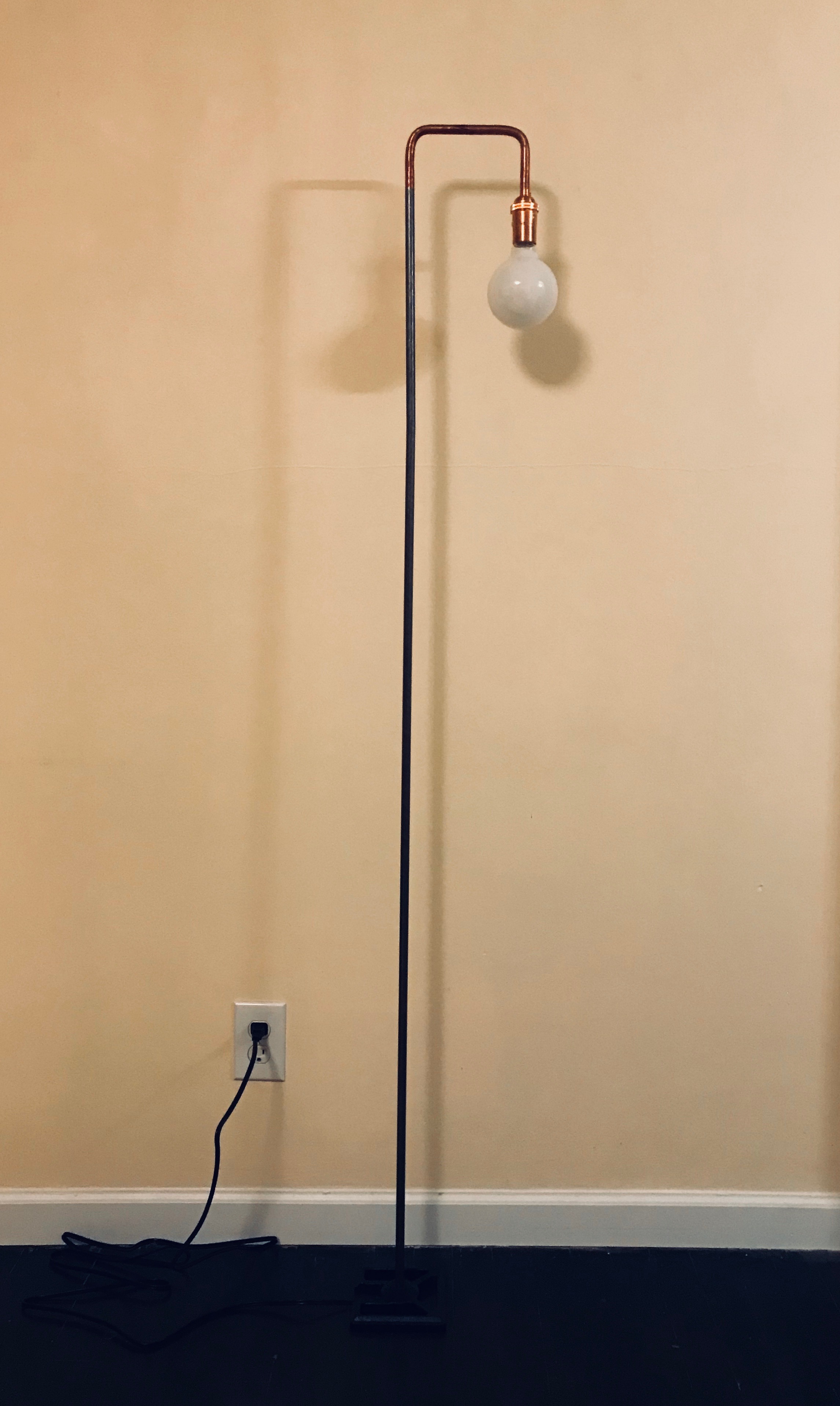 minimal footprint achieved through use of internally threaded copper and steel tubing and a small cast iron base for stability