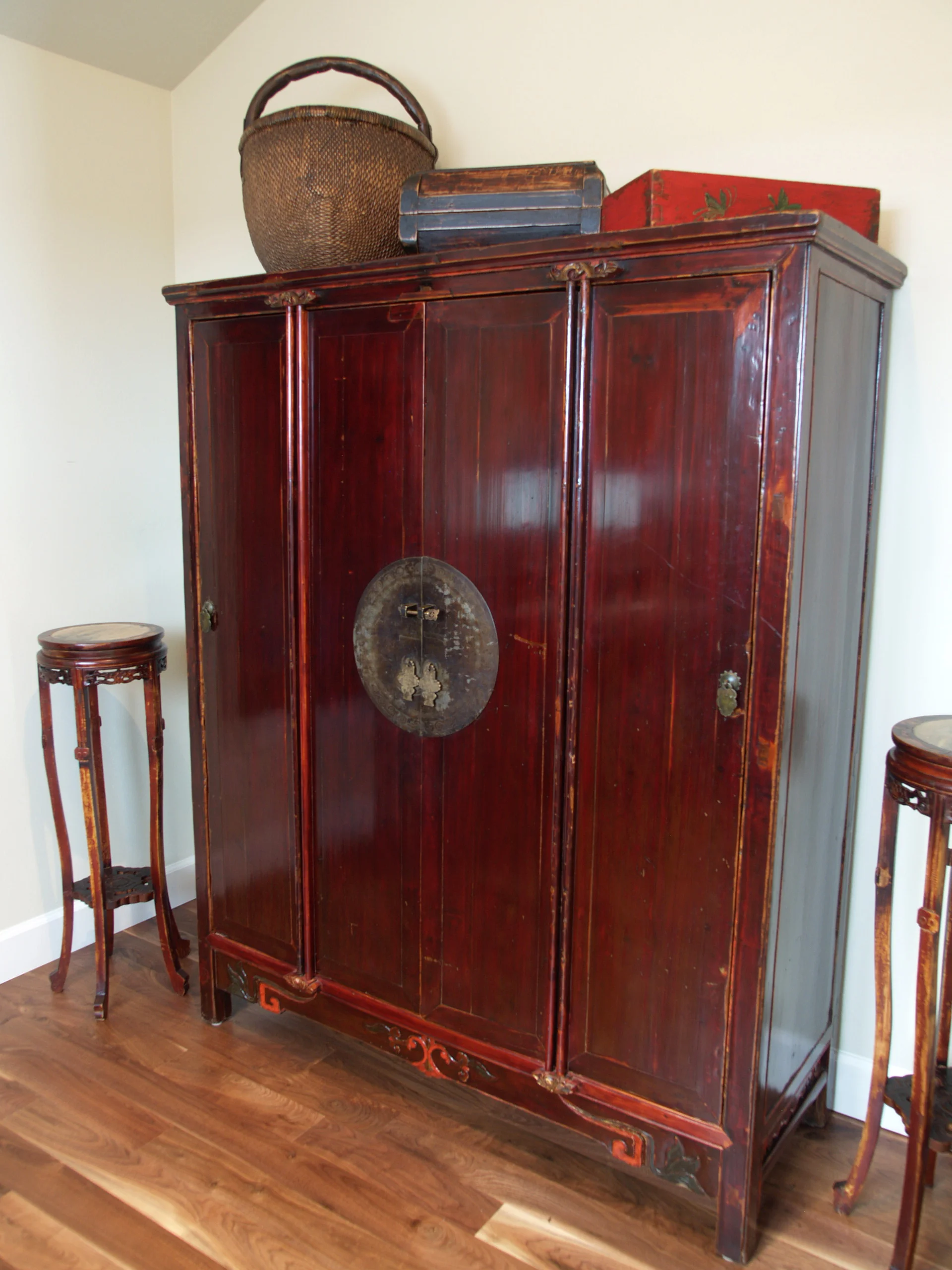 large armoire with marble plant stands