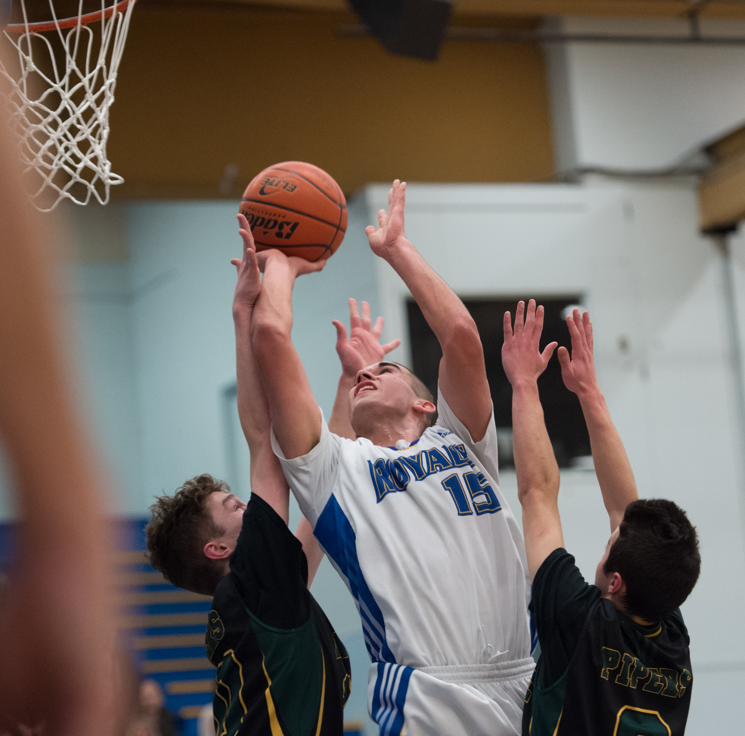 Handsworth's Player of the Game, Ben Grant stretches for 2 of his 21 points as the Handsworth Royals defeated the Argyle Pipers in AAA action at the Howe Sound Championships.