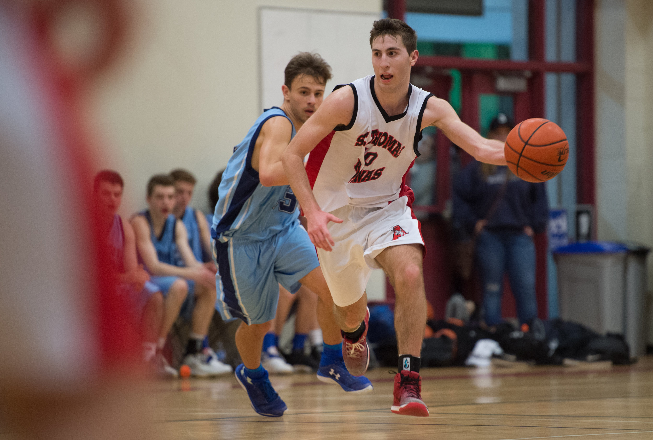 Matteo Botteselle drives through midcourt in STA's 94-78 victory over the Seycove Seyhawks. Botteselle was awarded the No Regrets Player of the Game for his efforts in the Howe Sound AA Championship Game.