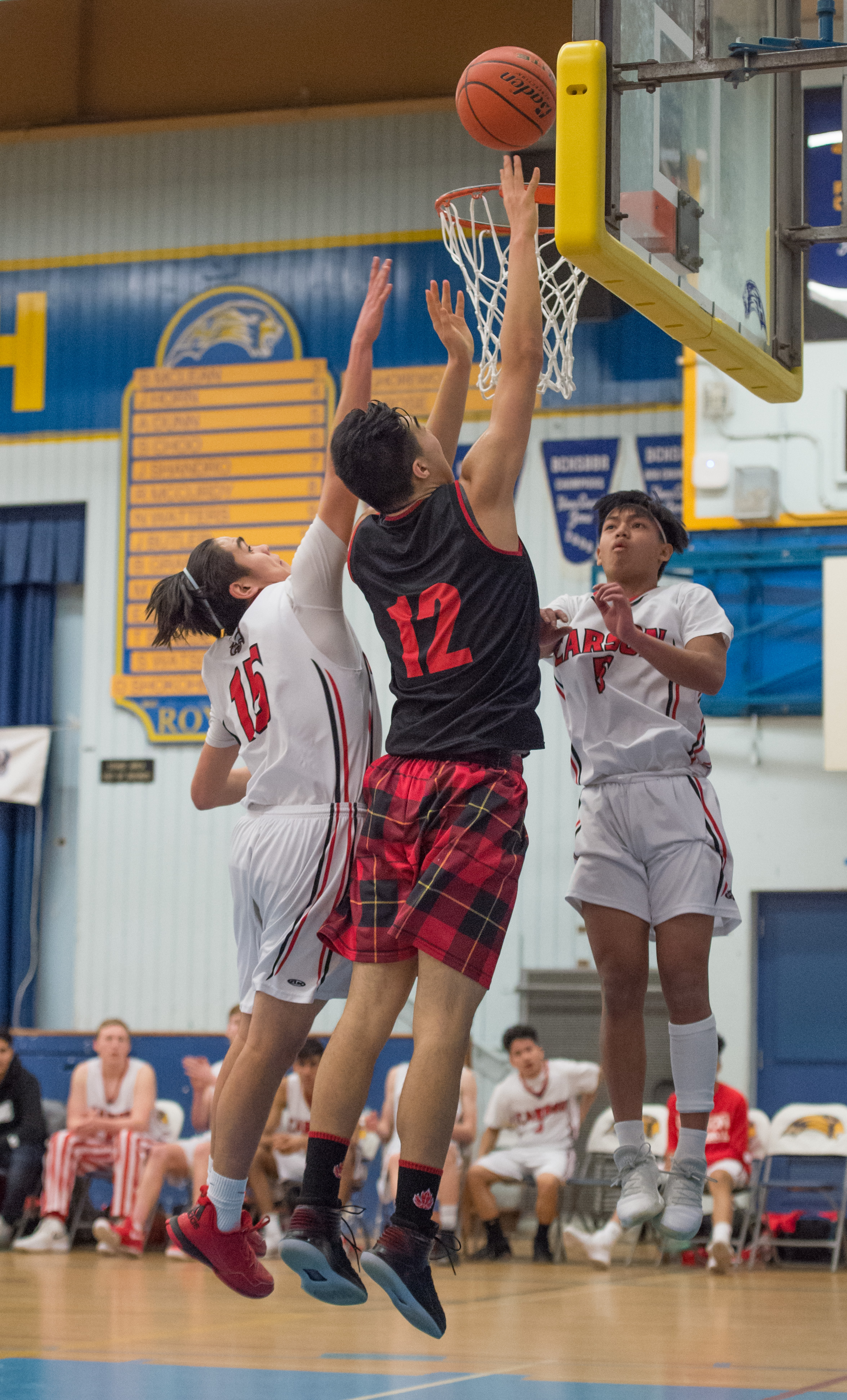 Kevin Li of the West Vancouver Highlanders drives to the hoop for 2 of his game high 29 points