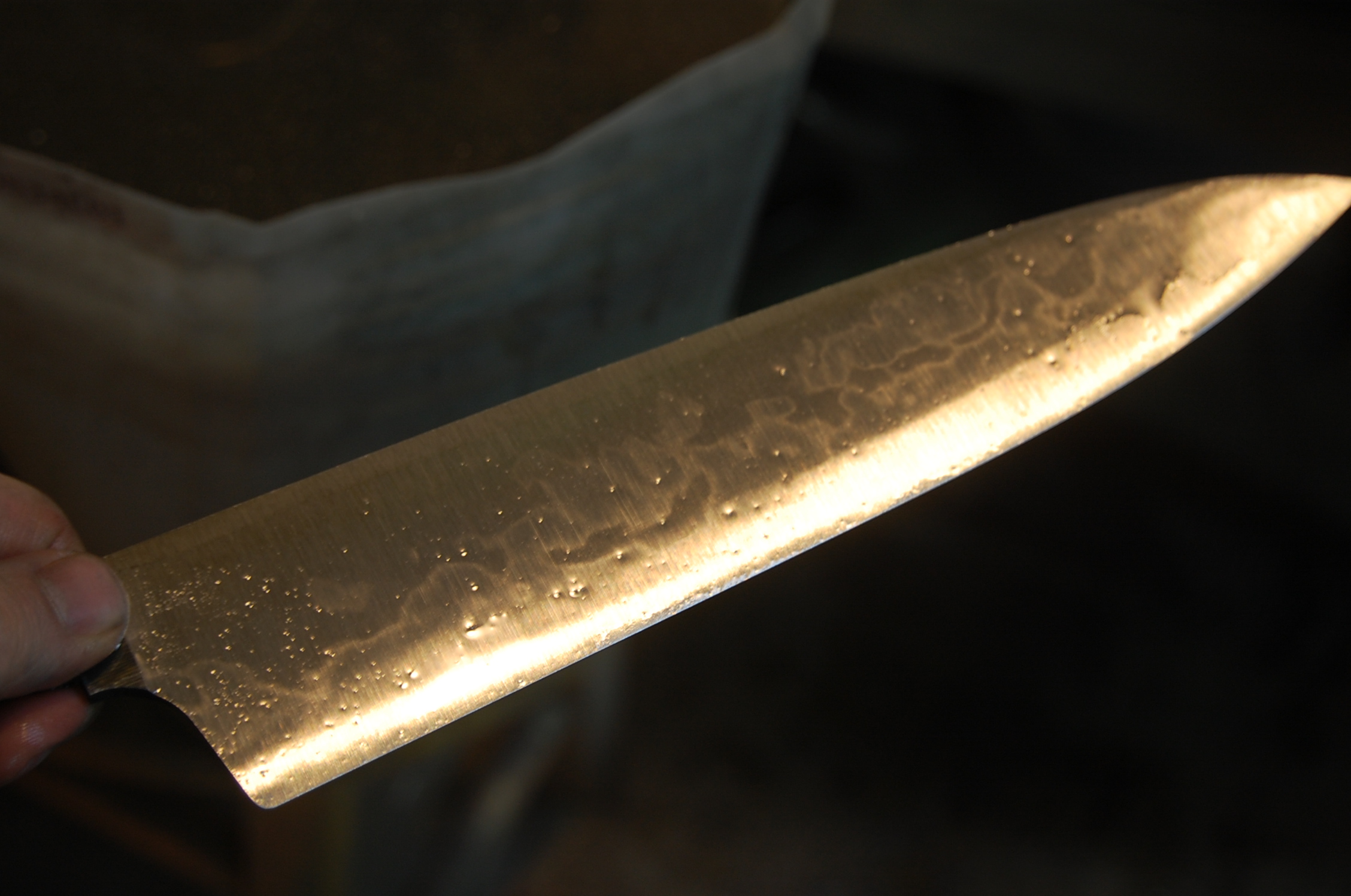 The hamon is begining to show after grinding.