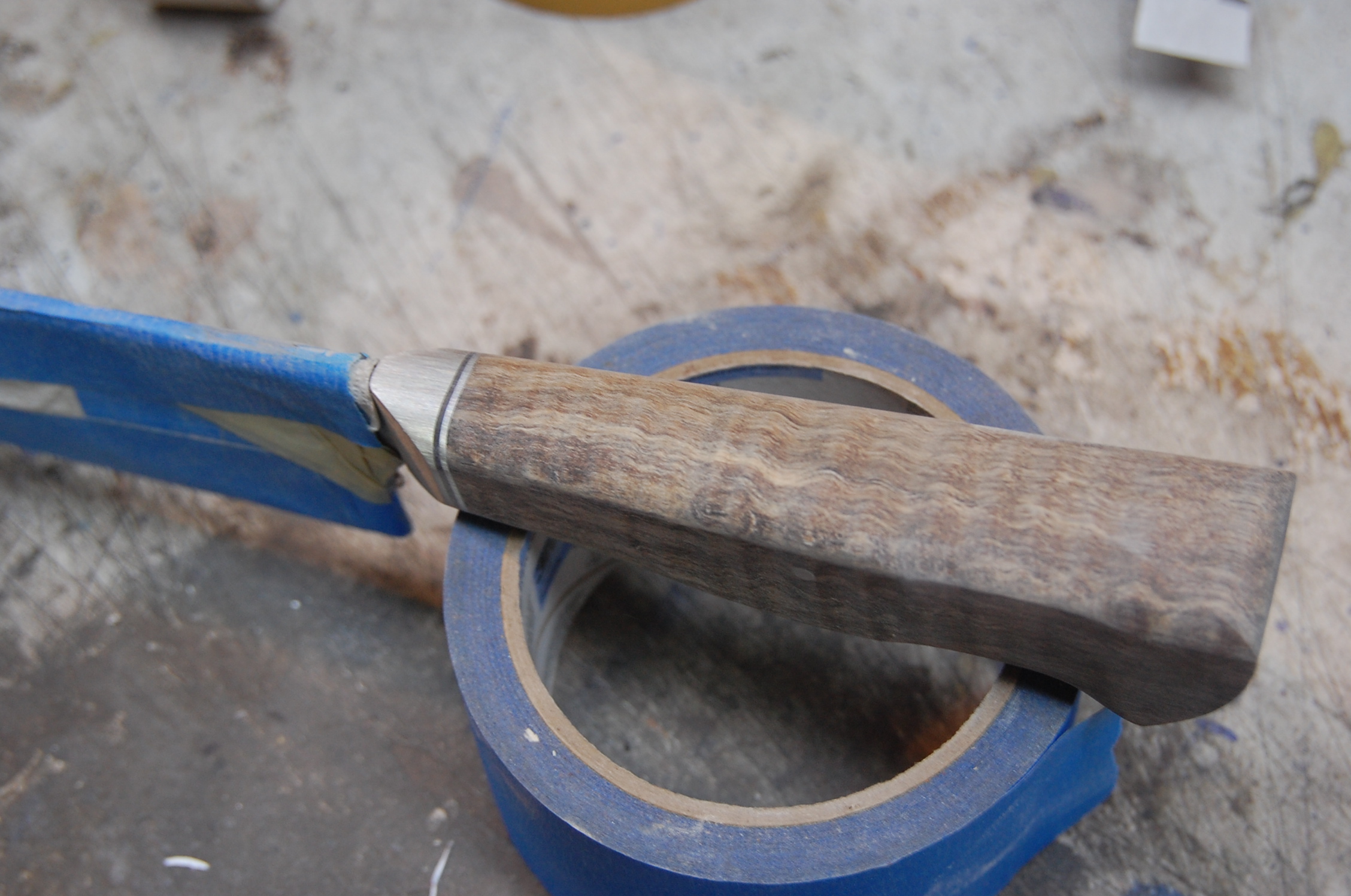 The taper is in and the sides are rounded.