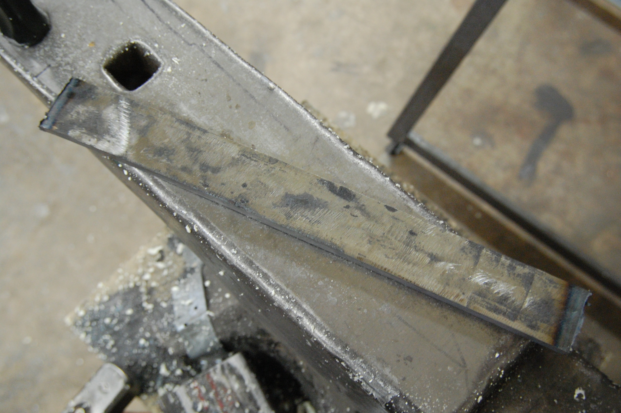 A billet that I forge welded and is currently at 88 layers of 52100 and 15N20.