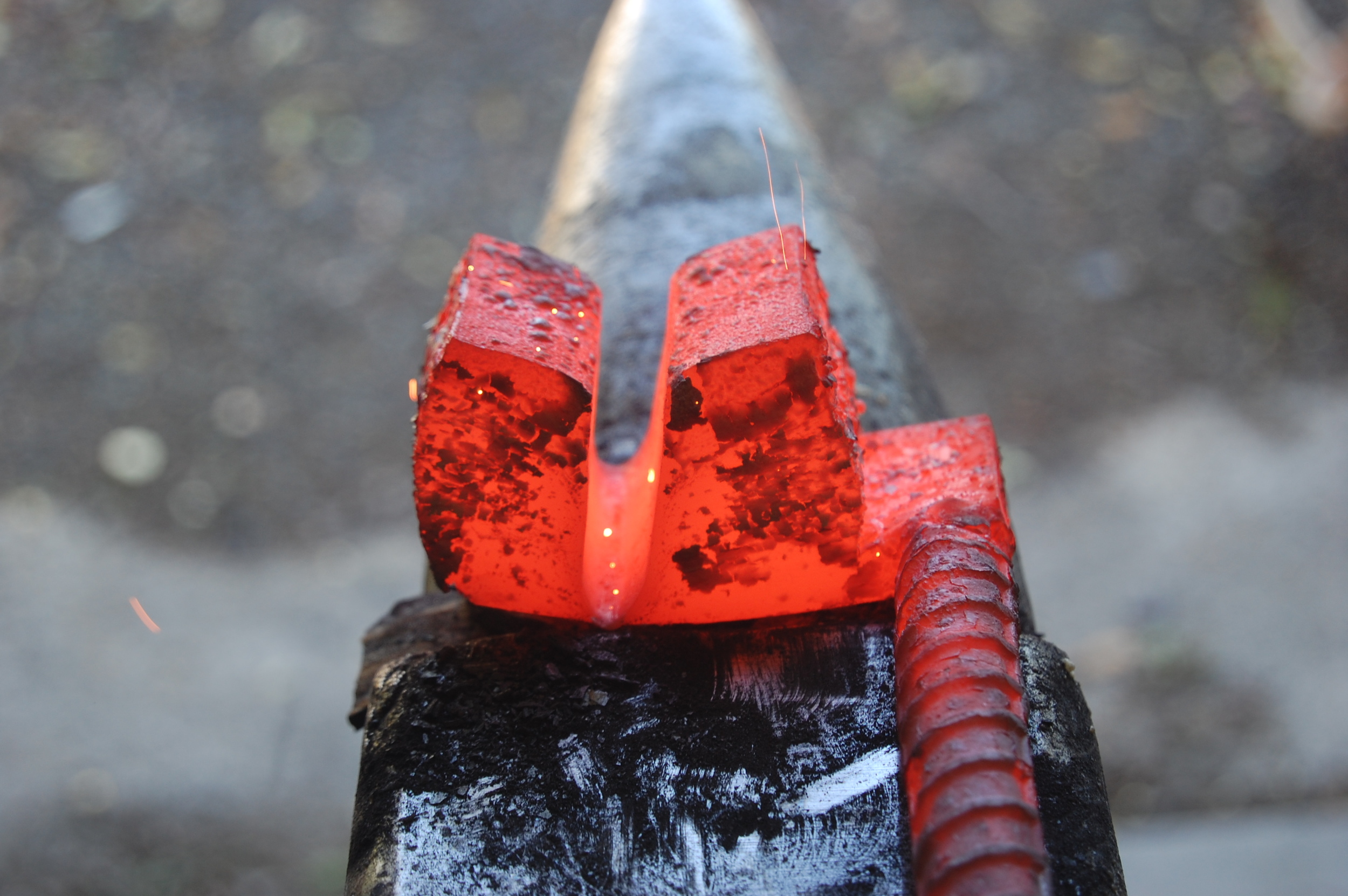 The seven layers have been forge welded and cut down the center to create the blade pattern.
