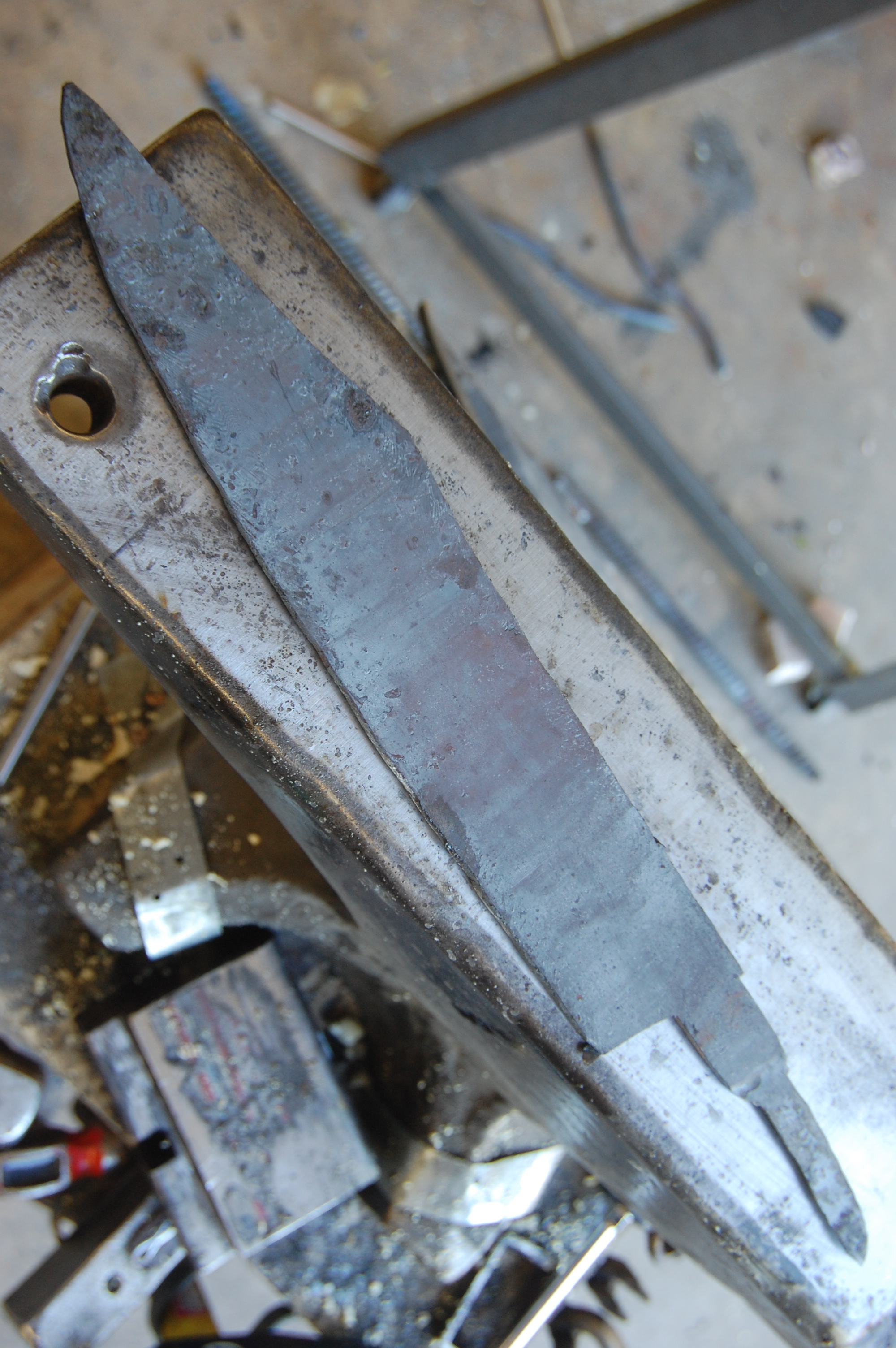 The two billet sections are forge welded back together and forged out to a basic shape.