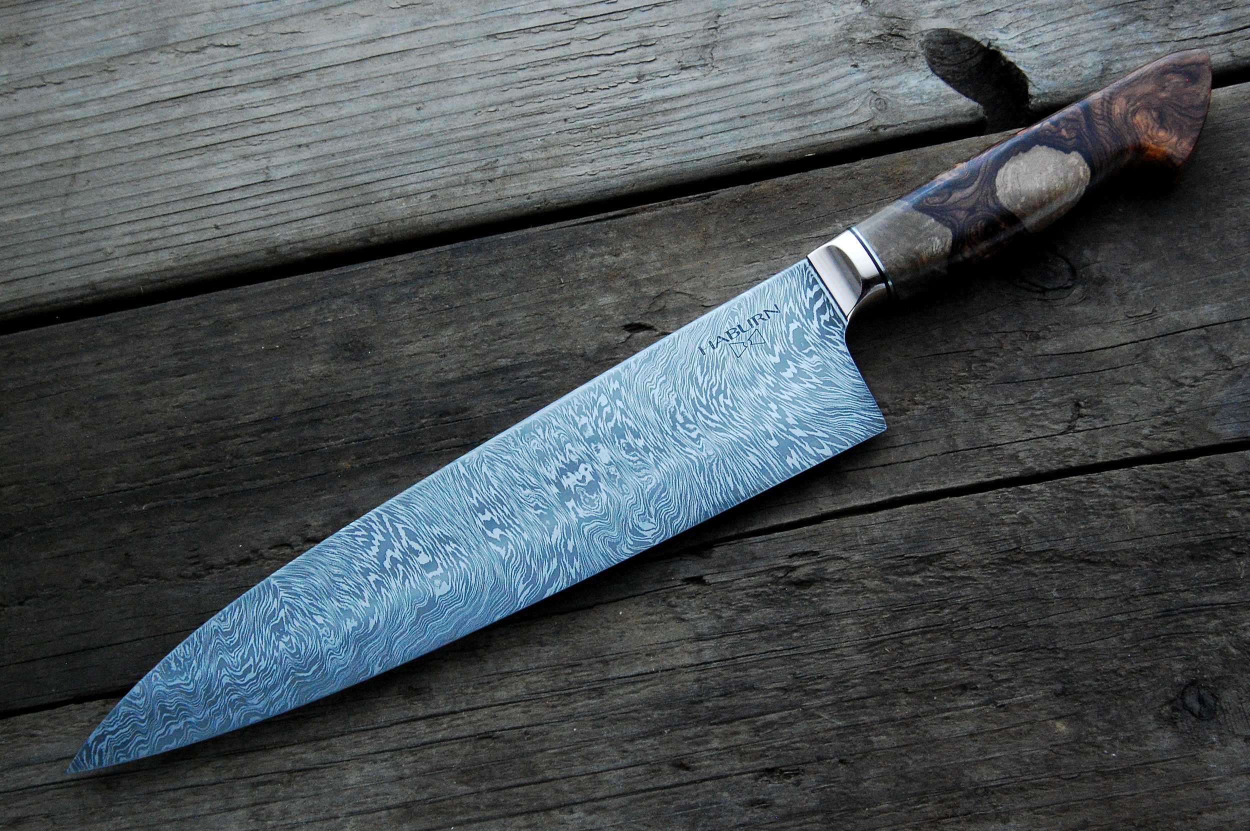 The second gyuto is a multi-bar damascus featuring two "W" patterns for a unique combination of swirls and curls. The blade is handled in my mokume-gane and a stunning piece of rosewood burl to compliment the damascus. Available 14 October.