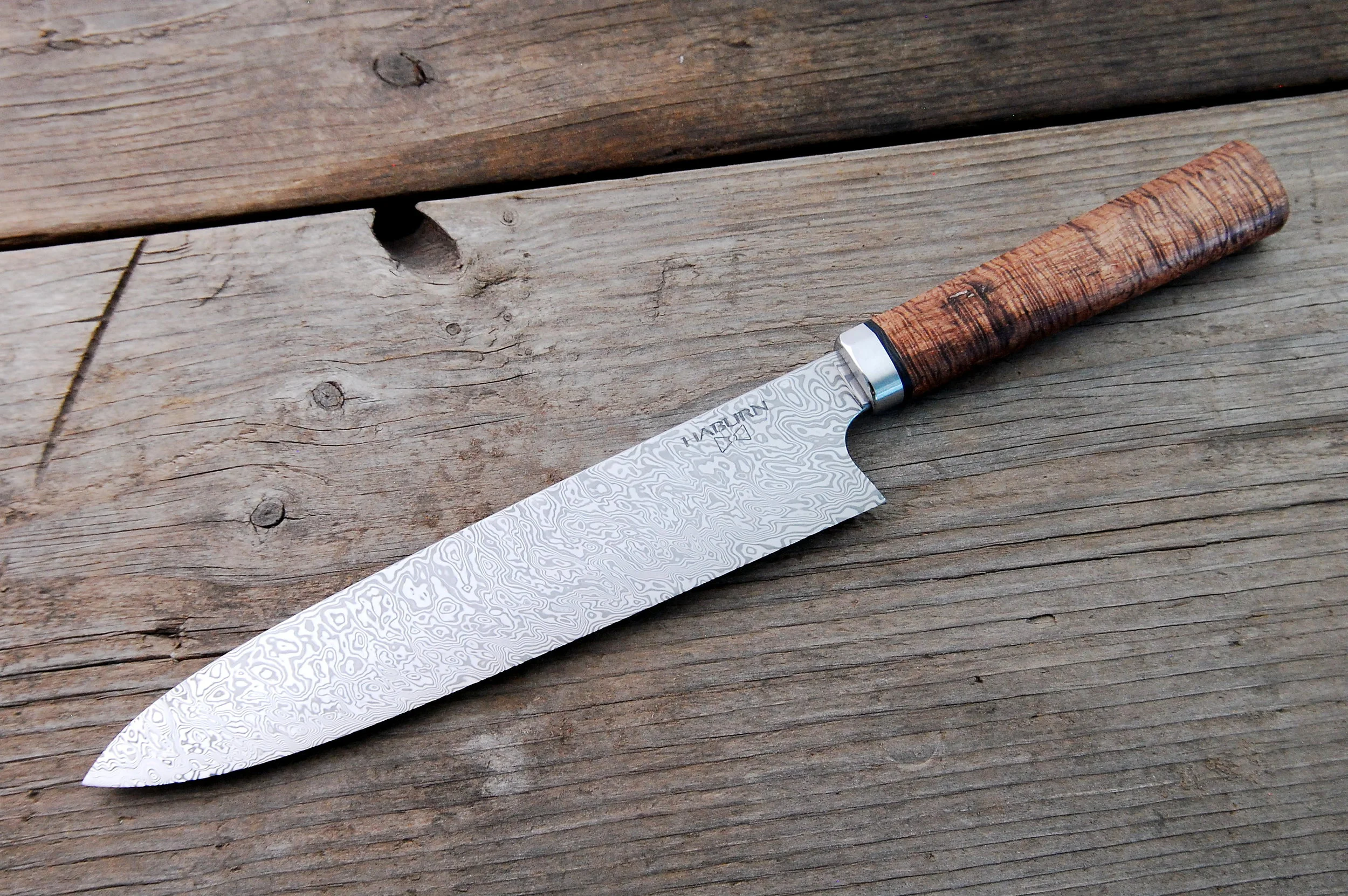 218mm stainless damascus with stainless bolster, exhibition grade koa and 5,760 year old boa oak.