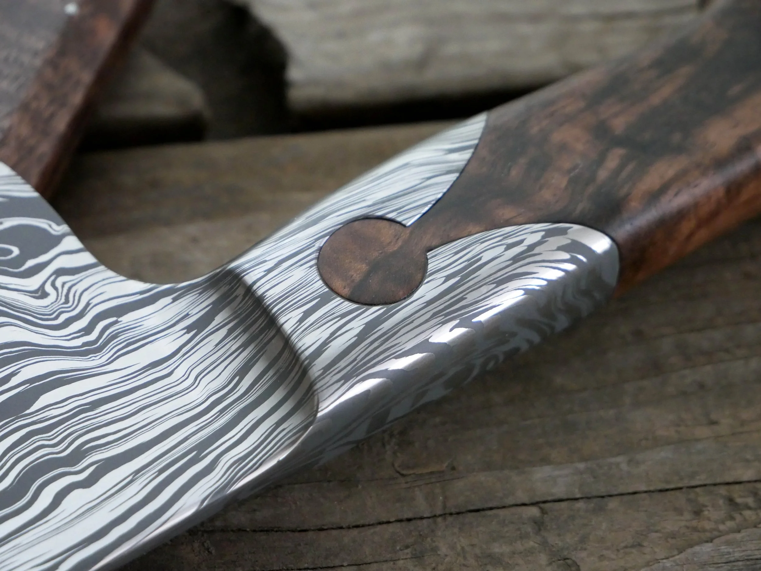 CPM154/NitroV stainless damascus integral keyhole detail.