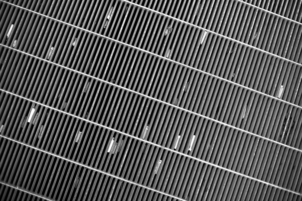 Looking straight down and angling to the left. The lines at an angle also create an optical illusion of the photograph looking crooked on the page.