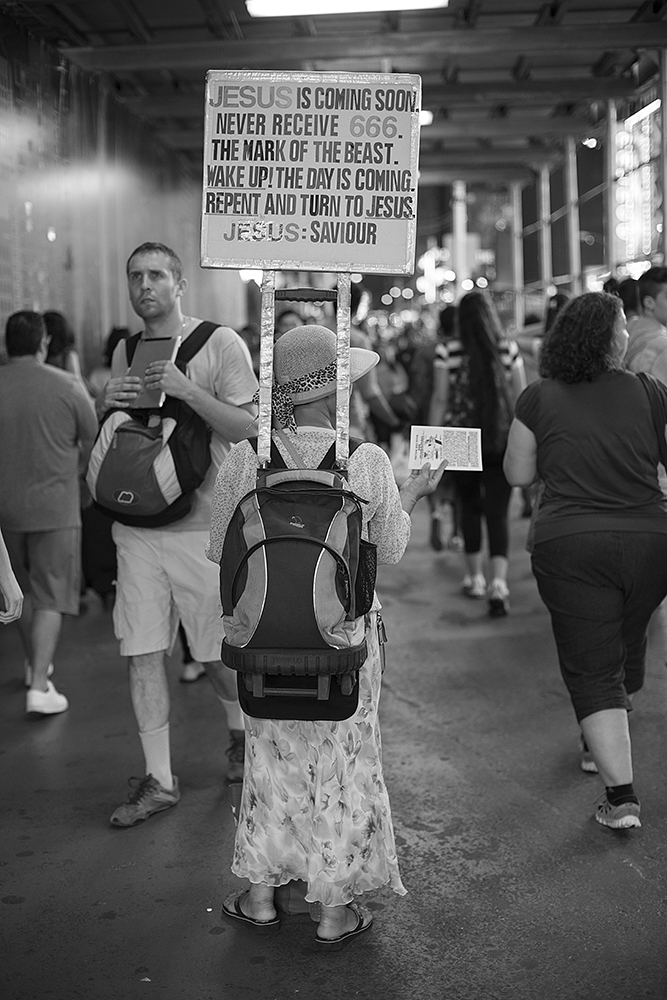 One of the most common of signs is probably the Jesus sign. This woman is a stalwart around Times Square. I really like the way her sign is rigged. It's a little strange to me that she has the '666' matching 'Jesus', both in red lettering.