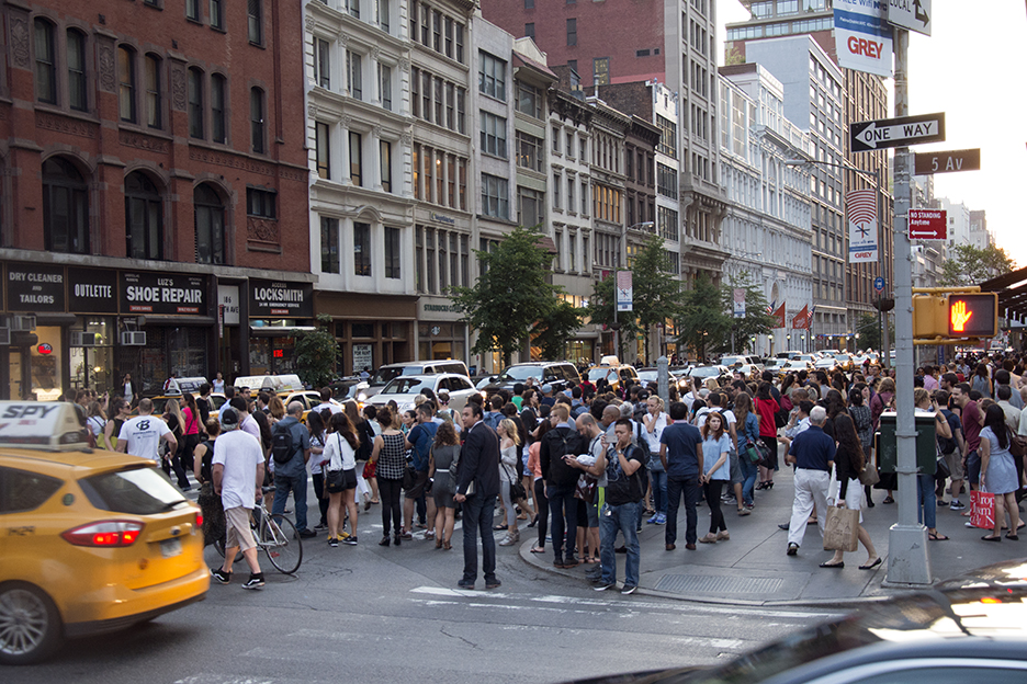 Facing the west where more people lined the street.