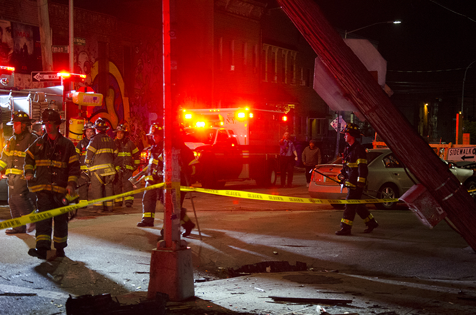 This is the same STOP sign on the right of this photograph, with the crashed car behind it.